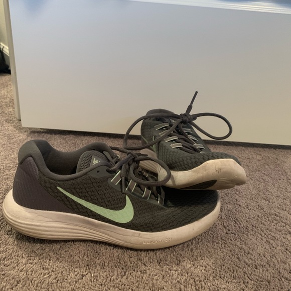 Gray and green nike running shoes